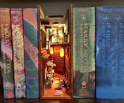 An example of a book nook shelf insert. The one pictured is Harry Potter themed.