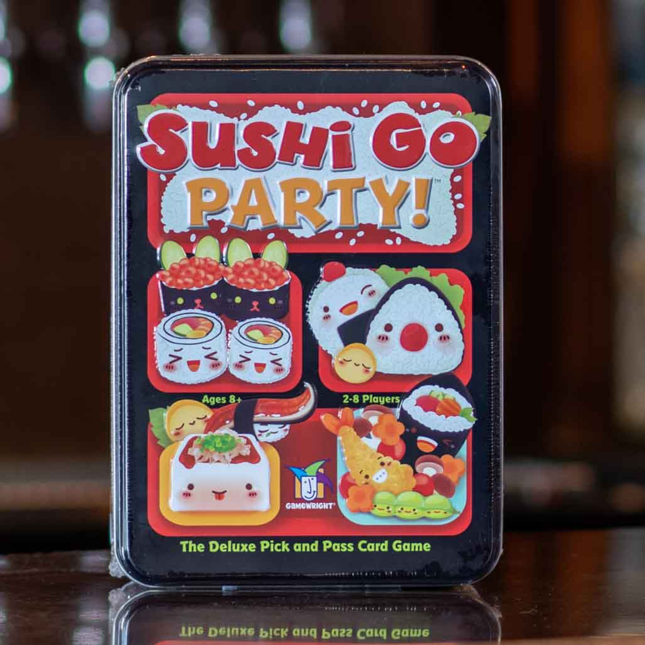 A picture of the board game Sushi Go Party. The cover is emblazoned with illustrations of cartoon sushi.