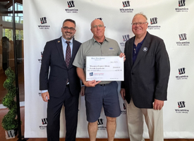 Shore Distributers with big check