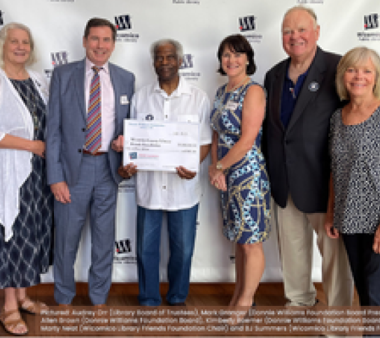 Donnie Williams Foundation members with big check