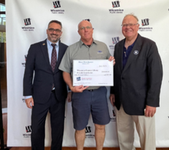 Shore Distributers with big check