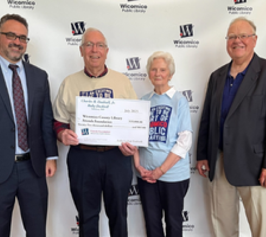 Chip Dashiell and his wife Ruby donating money for the Library