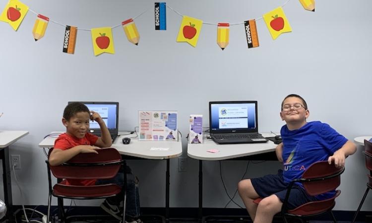 Children doing homework on computers