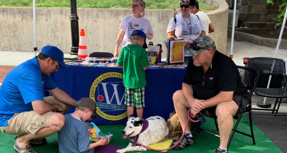 Paws to Read Event where children read to dogs